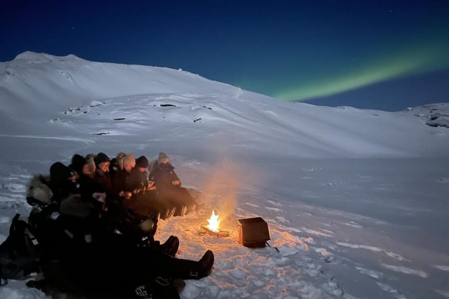 Björkliden/Abisko: Night Sky Snowmobile Tour - Pickup, van transfer, and getting geared up fast